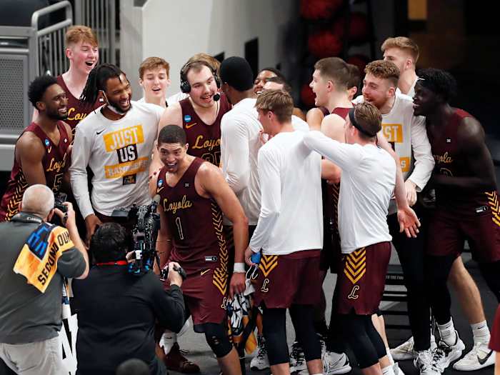 Loyola Chicago swarms Cameron Krutwig during an interview